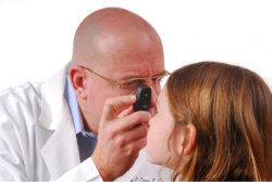 doctor checking the eye of his patient